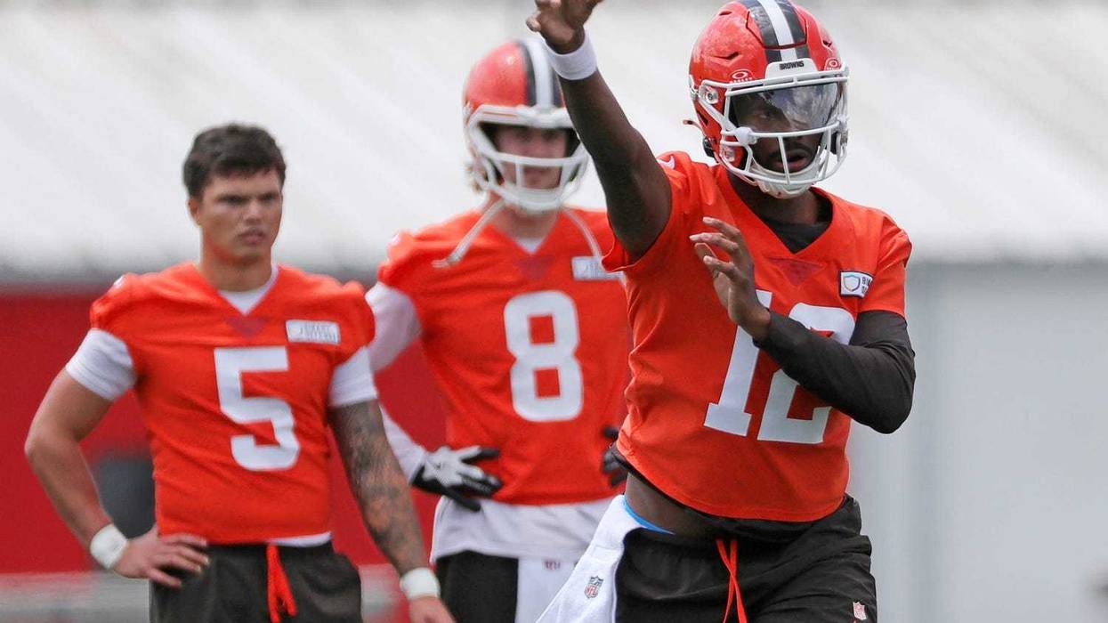 Browns quarterback Shedeur Sanders throws as QBs Dillon Gabriel (5) and Kenny Pickett look on during minicamp, Tuesday, June 10, 2025, in Berea.