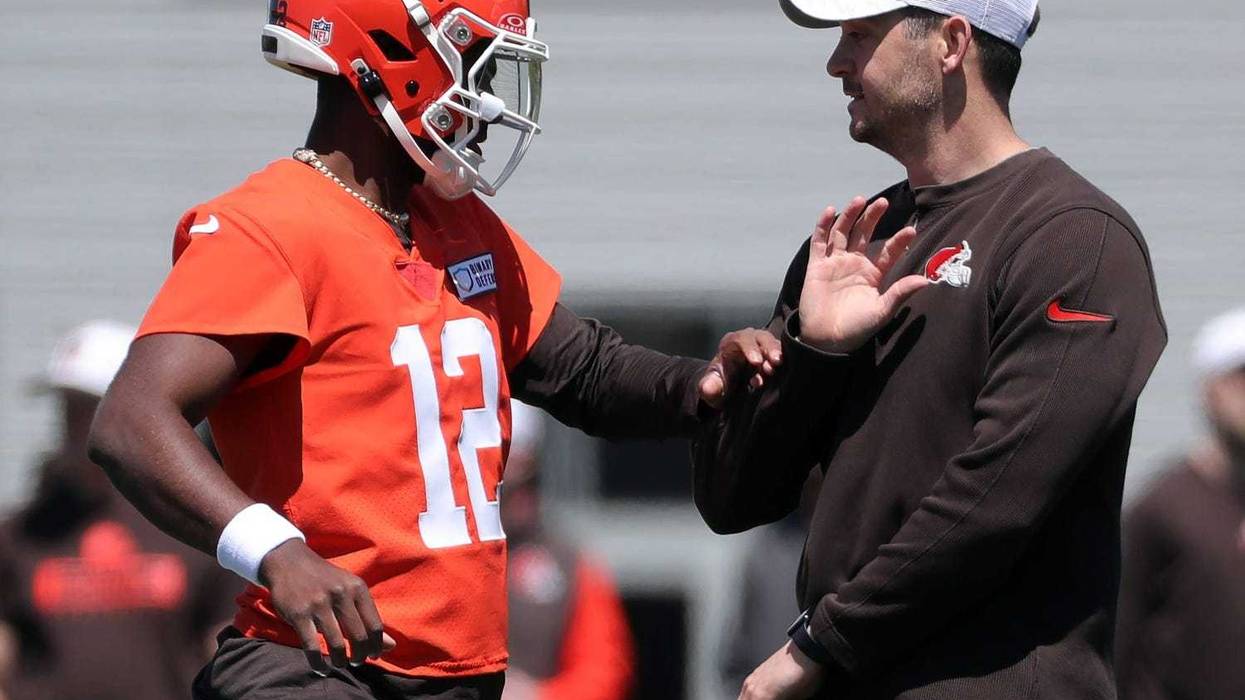 Browns quarterback Shedeur Sanders works with offensive coordinator Tommy Rees during rookie minicamp May 9, 2025, in Berea.