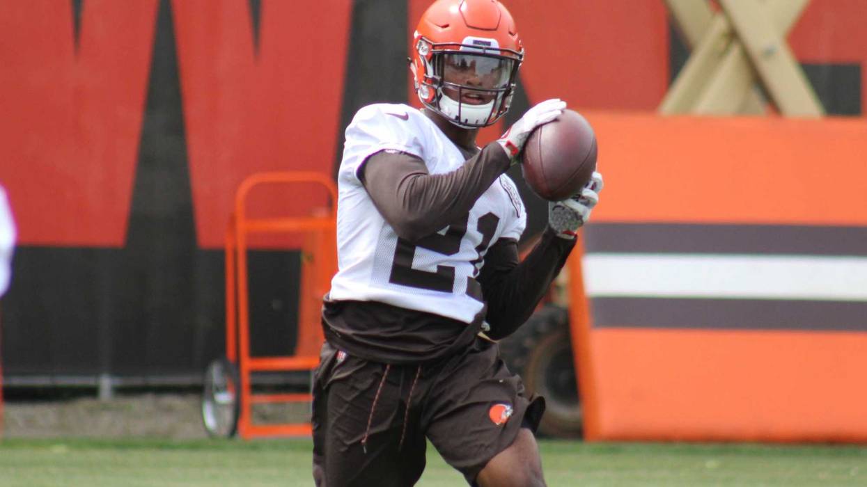 Browns rookie cornerback Denzel Ward catches a ball as part of an interception drill during June minicamp