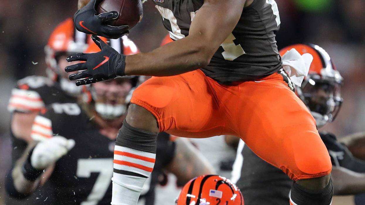Browns running back Nick Chubb hurdles Bengals cornerback Mike Hilton as he rushes for a first-half first down Monday, Oct. 31, 2022, in Cleveland