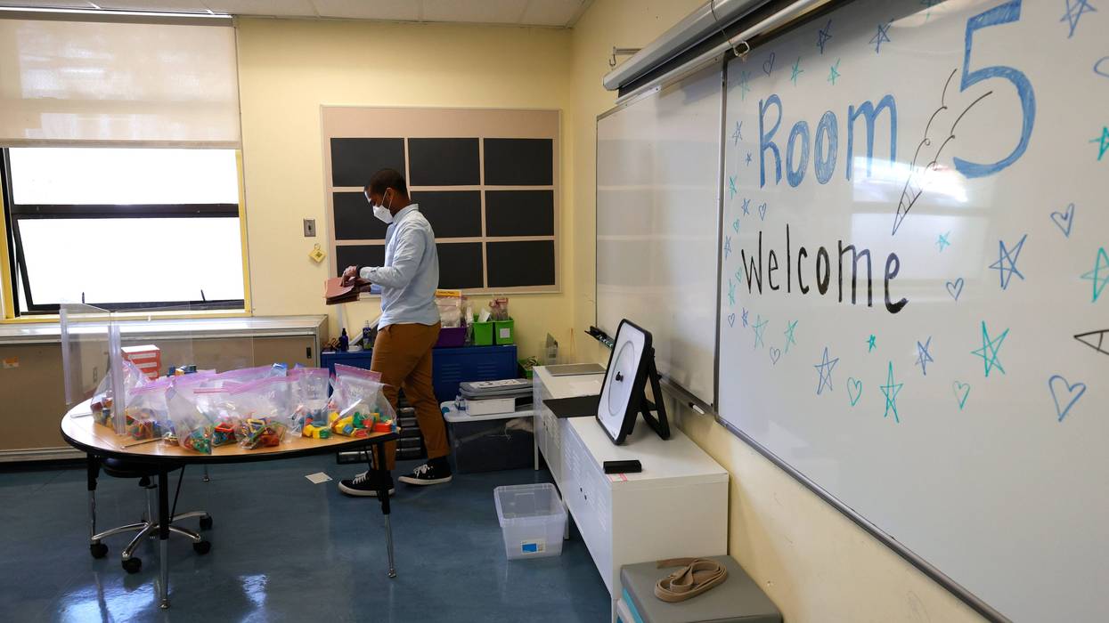 Bryant Elementary School kindergarten teacher Chris Johnson sets up his classroom on April 09, 2021 in San Francisco, California.
