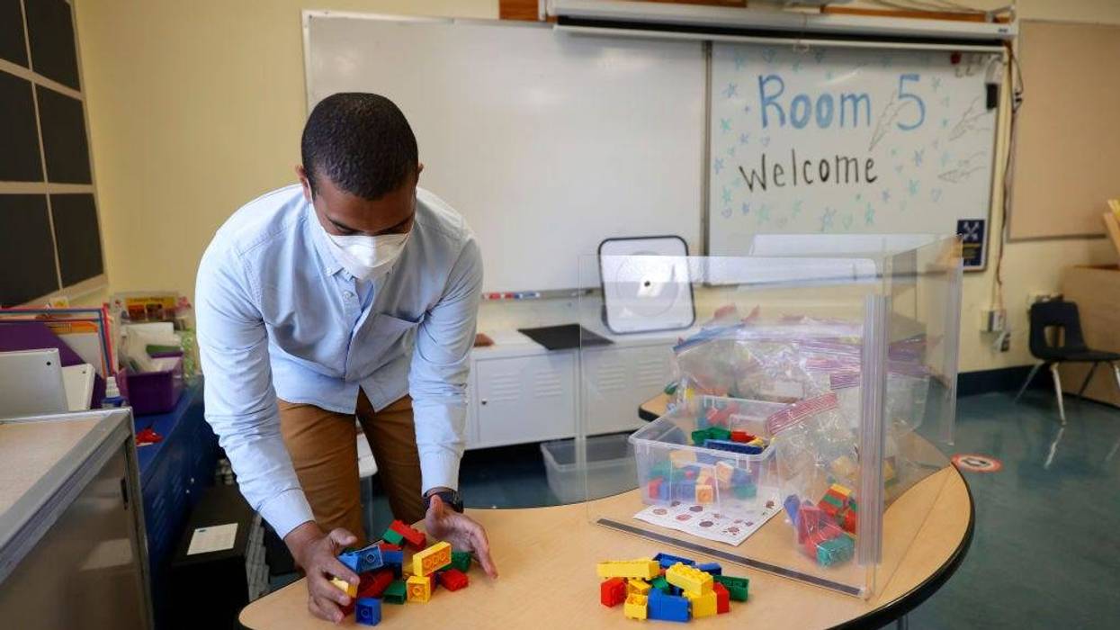 Bryant Elementary School kindergarten teacher Chris Johnson sets up his classroom on April 09, 2021 in San Francisco, California.