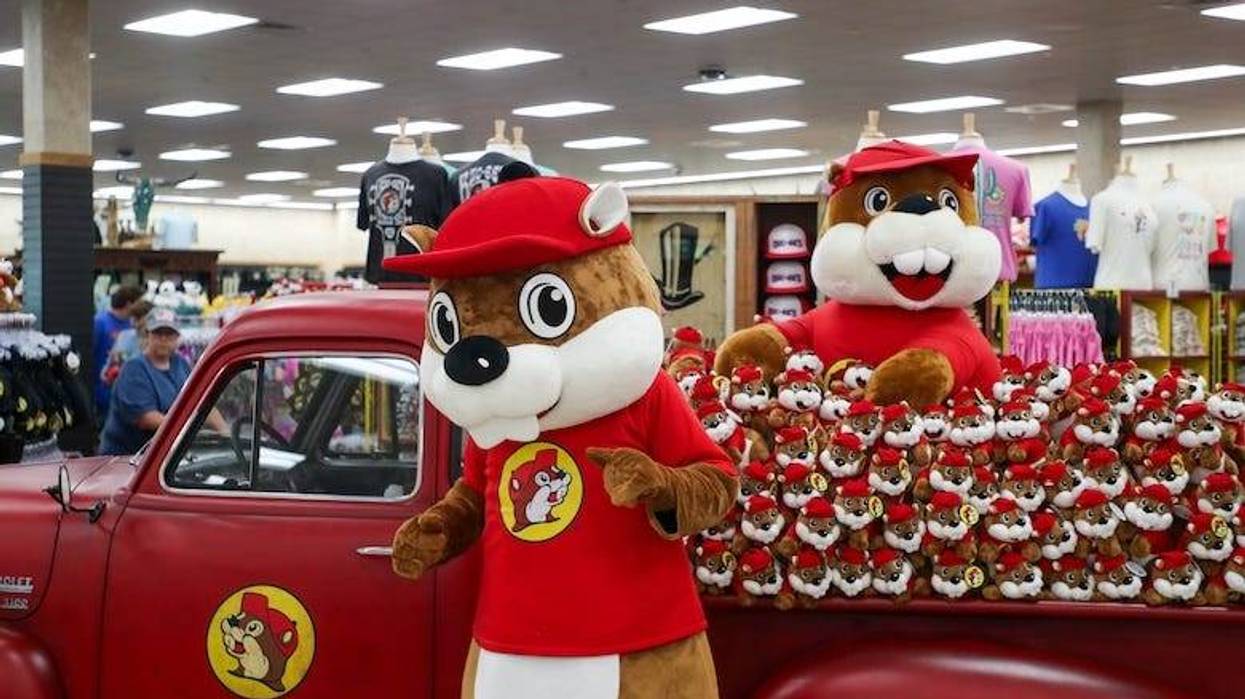 Buc-ee’s beaver standing in front of stuffed animals