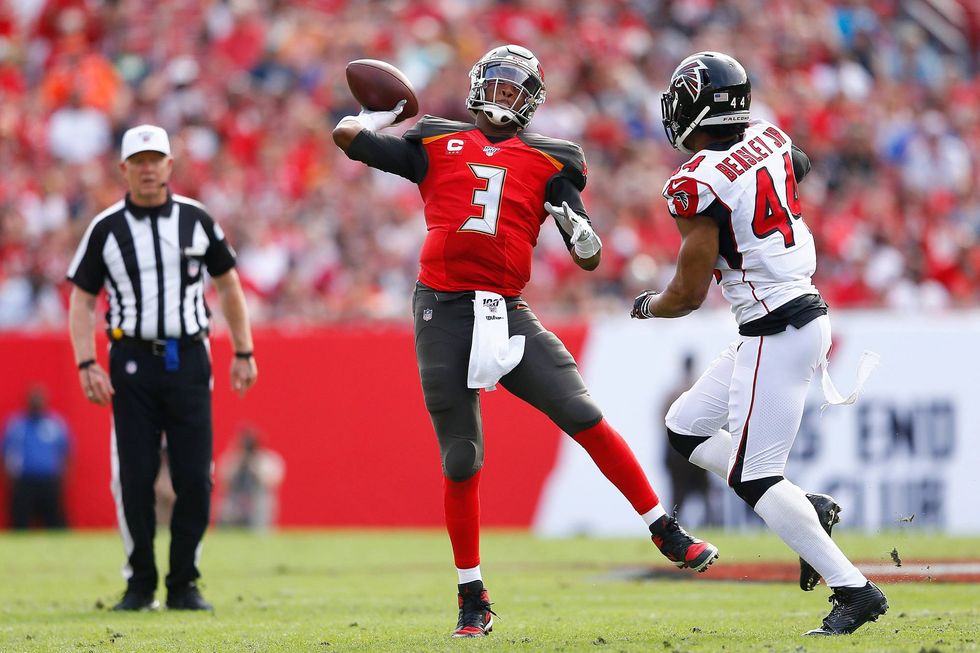 Buccaneers QB Jameis Winston throws on the run