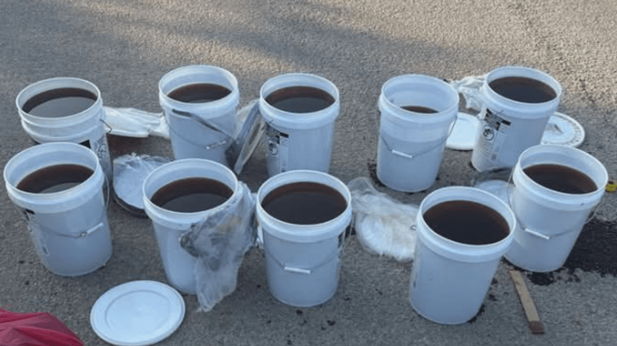 Buckets of liquid methamphetamine recovered from car crash