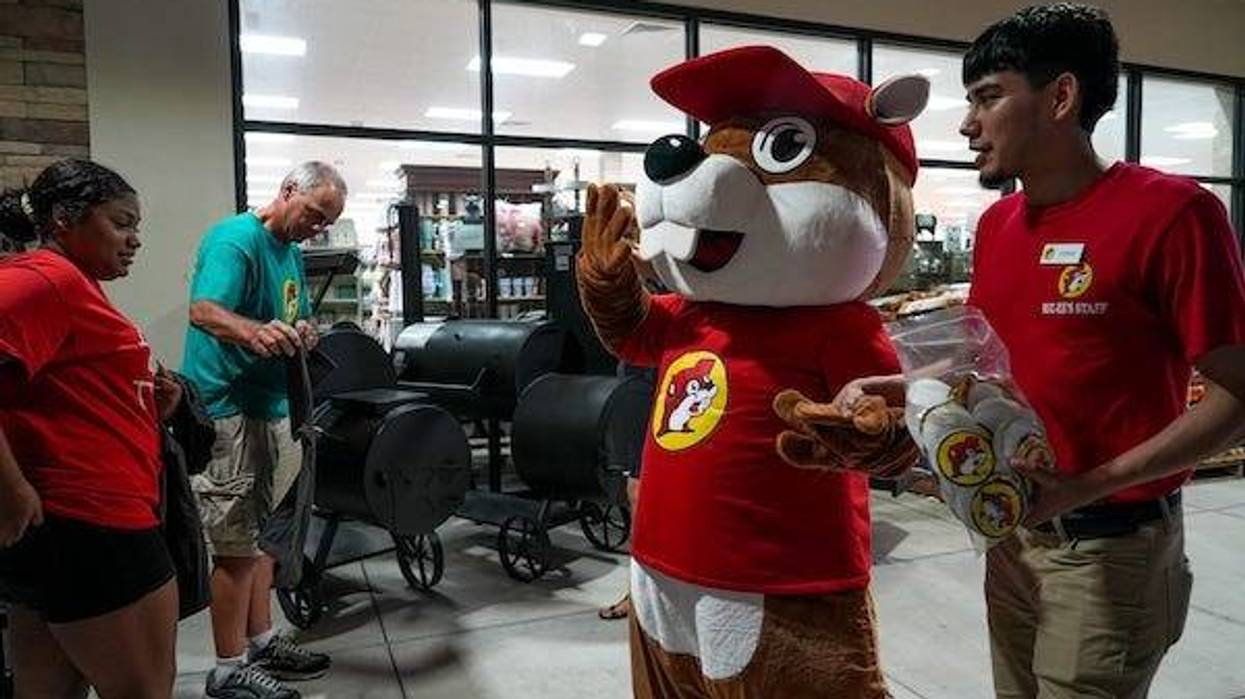 Bucky the Beaver waving to customers