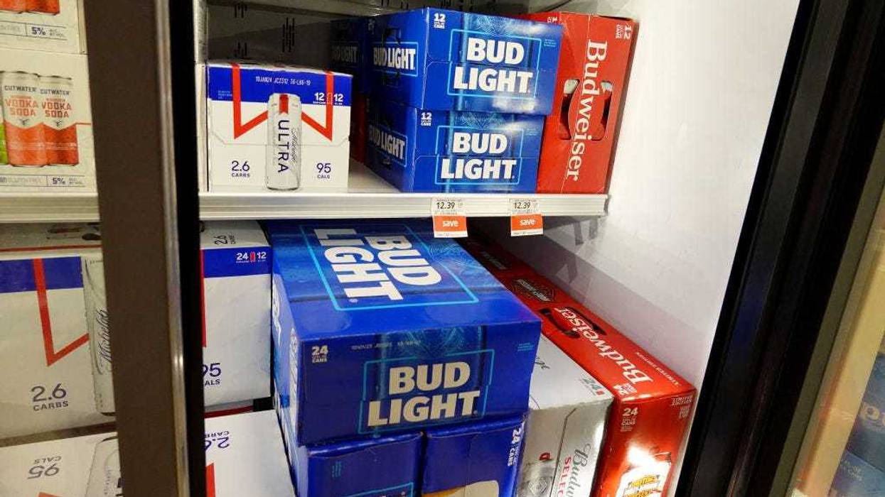 Bud Light, made by Anheuser-Busch, sits on a store shelf on July 27, 2023 in Miami, Florida. Anheuser-Busch InBev announced it will lay off hundreds of corporate employees as its Bud Light beer sales continue to struggle. (Photo by Joe Raedle/Getty Images)