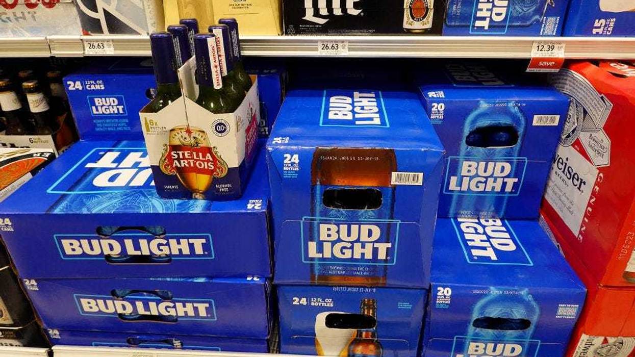 Bud Light, made by Anheuser-Busch, sits on a store shelf on July 27, 2023 in Miami, Florida. Anheuser-Busch InBev announced it will lay off hundreds of corporate employees as its Bud Light beer sales continue to struggle. (Photo by Joe Raedle/Getty Images)