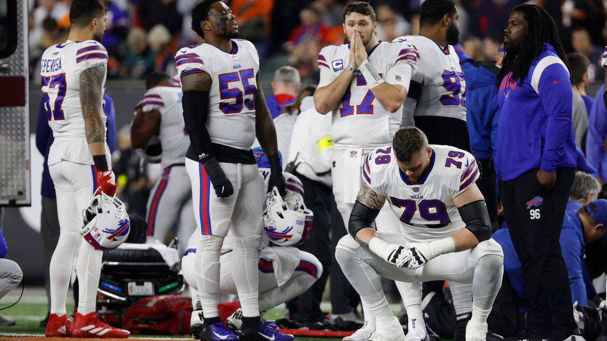 Buffalo Bills players react after teammate Damar Hamlin was injured against the Cincinnati Bengals during the first quarter in Cincinnati, 1/2/23