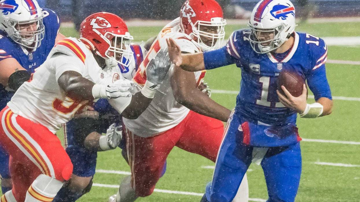 Buffalo Bills quarterback Josh Allen (17) runs against Kansas City Chiefs defensive tackle Tershawn Wharton (98) in the fourth quarter at Bills Stadium.