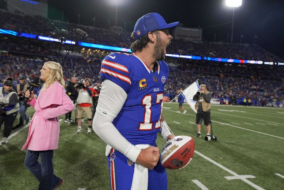 Buffalo Bills quarterback Josh Allen yells after his team won 41-40 in the final seconds against the Baltimore Ravens at Highmark Stadium in Orchard Park on Sept. 7, 2025. He received a Sunday night football which he later through to fans in the stands.
