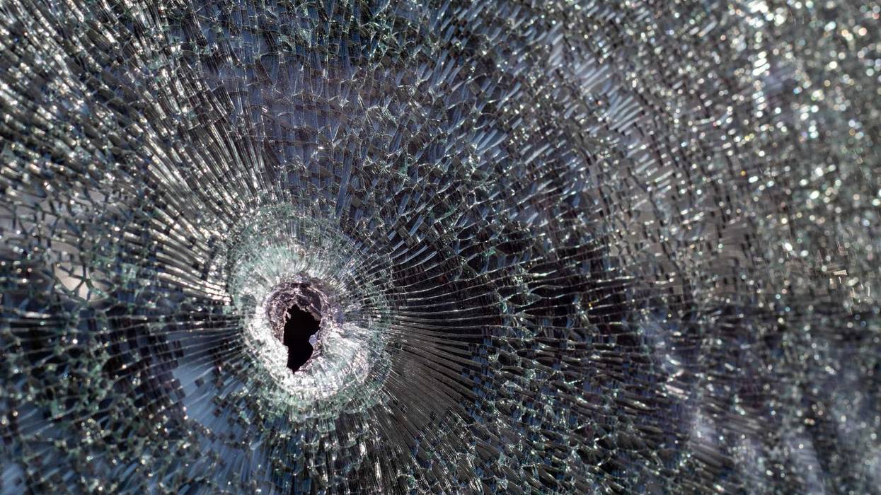 Bullet hole in a windshield.