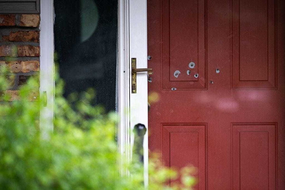 Bullet holes are seen in the door outside the home of DFL State Sen. John Hoffman on June 15, 2025 in Champlin, Minnesota.