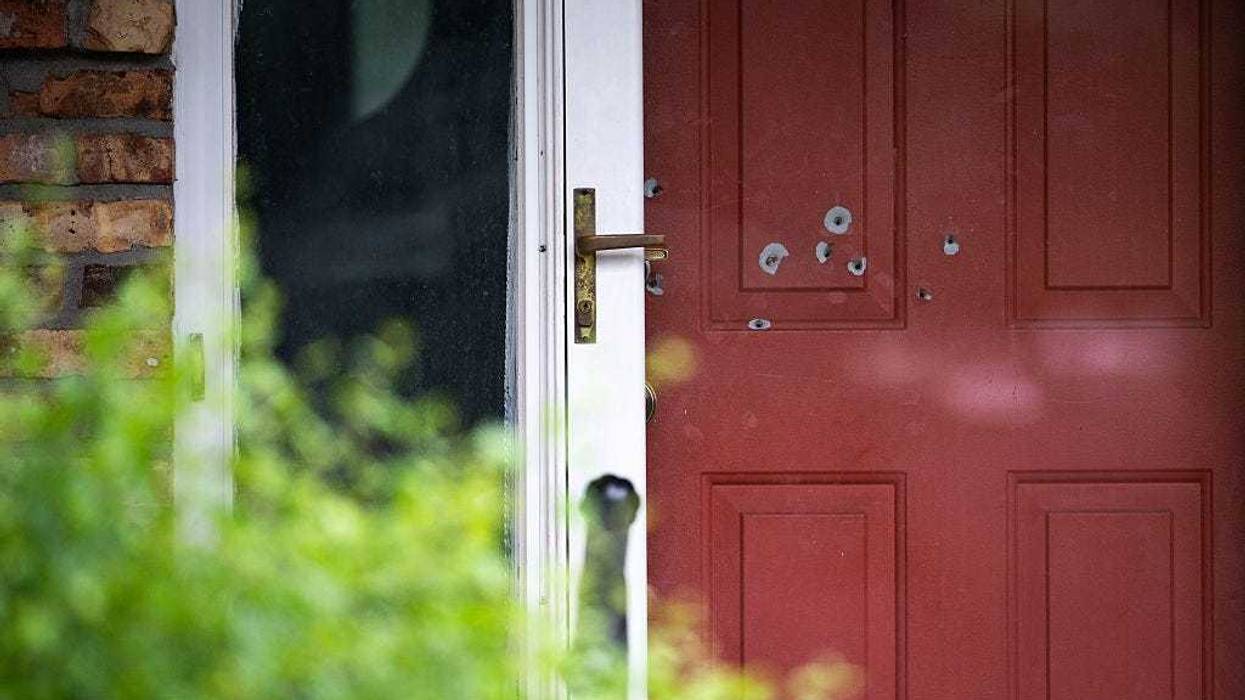 Bullet holes are seen in the door outside the home of DFL State Sen. John Hoffman on June 15, 2025 in Champlin, Minnesota.