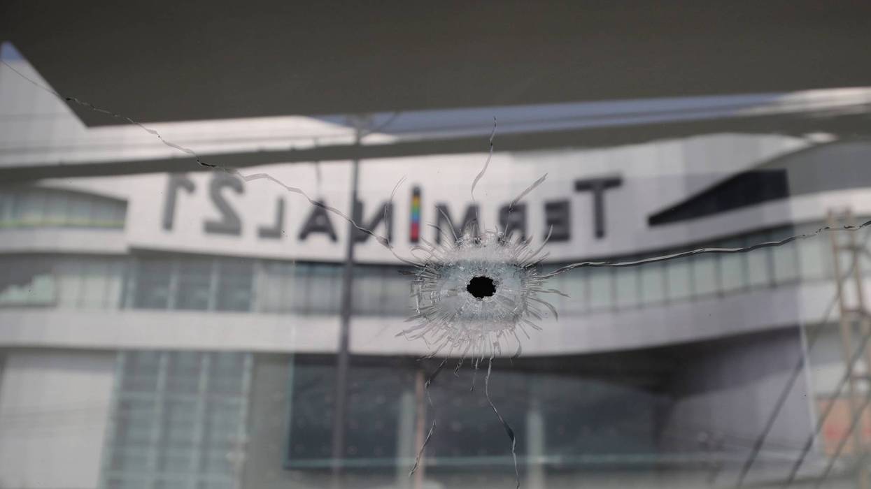 Bullet holes reflect the Terminal 21 Korat mall in Nakhon Ratchasima, Thailand, Sunday.