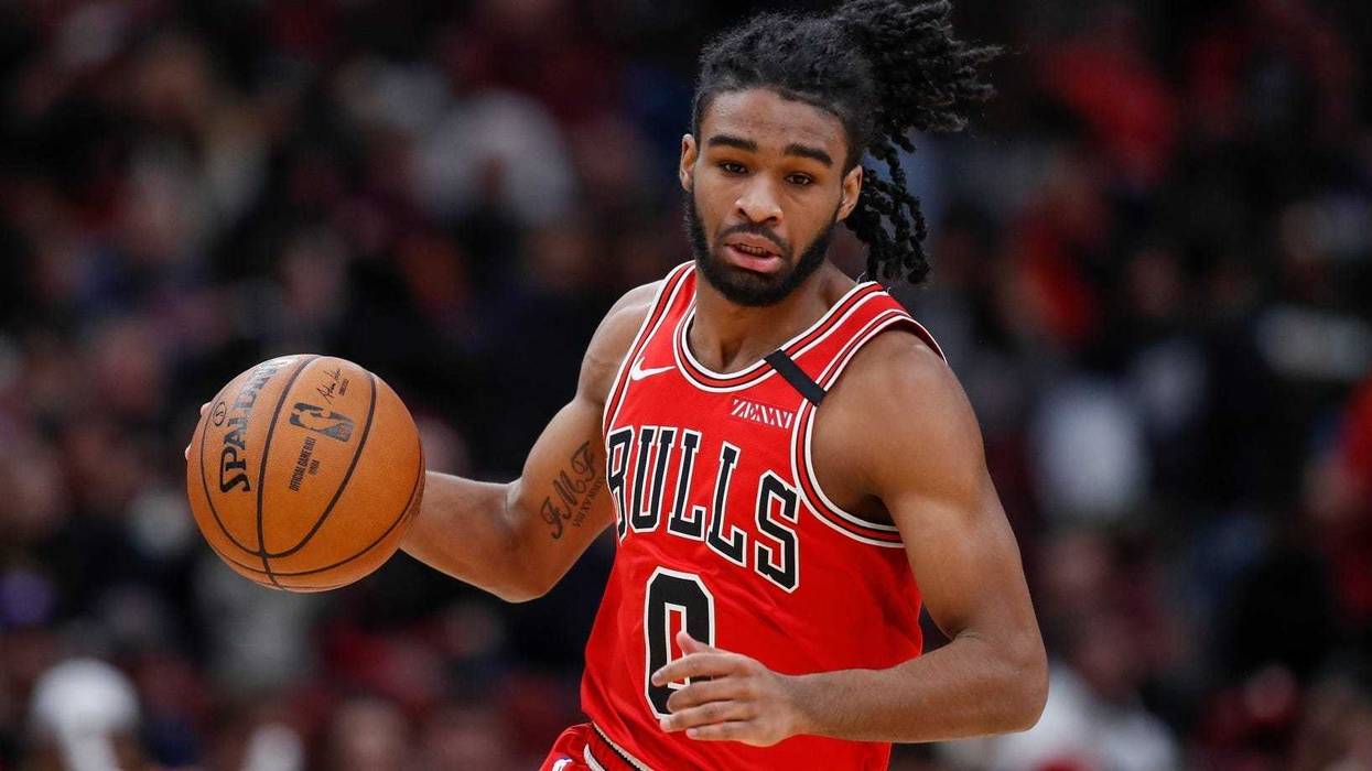 Bulls guard Coby White (0) brings the ball up court against the Wizards.