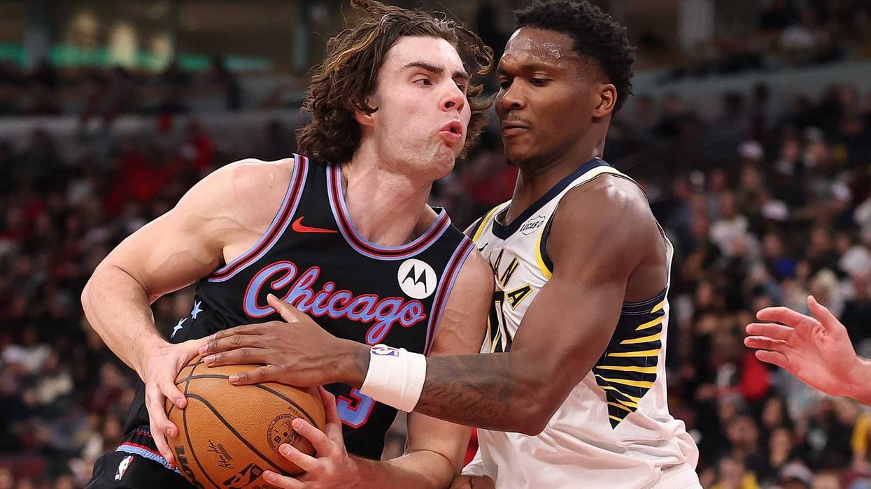 Bulls guard Josh Giddey, left, drives to the hoop against Pacers guard Bennedict Mathurin.