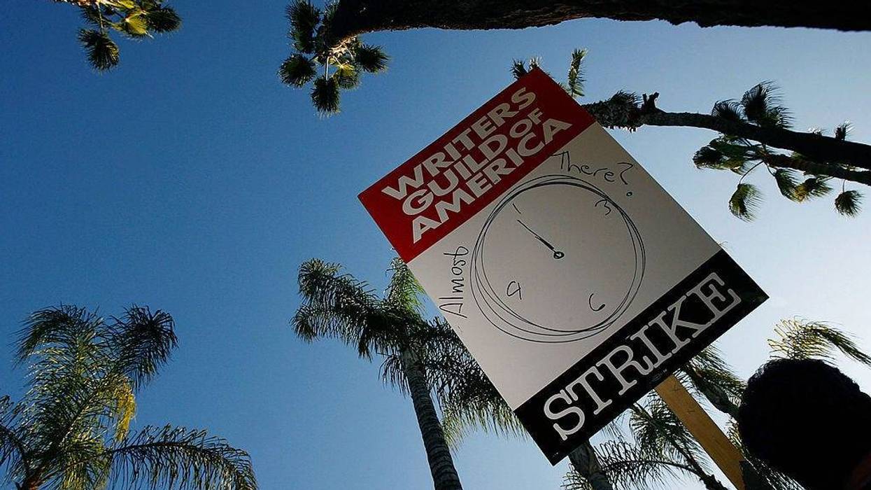 BURBANK, CA - FEBRUARY 08: A picket sign addresses the question of whether the strike may end soon while Writers Guild of America members and supporters picket in front of NBC studios as hope grows that a draft copy of a proposed deal with Hollywood studios being completed today could lead to an end to the three-month old Hollywood writers strike within days, on February 8, 2008 in Burbank, California.