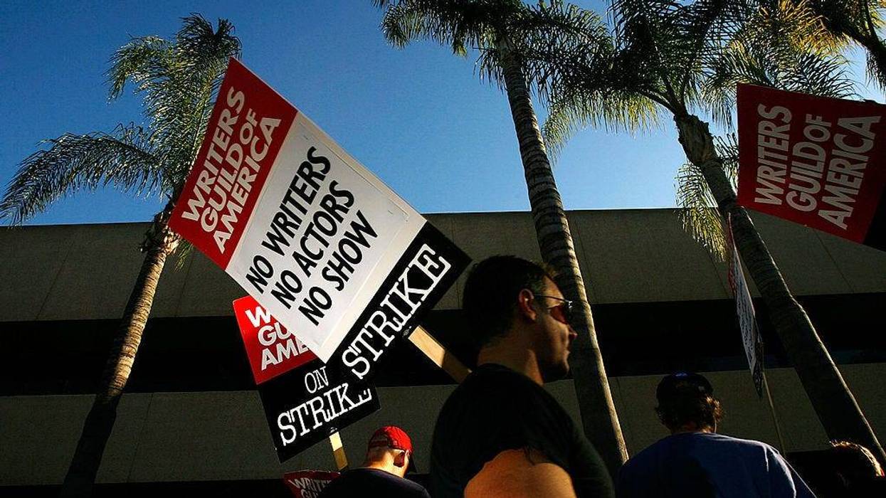 BURBANK, CA - FEBRUARY 08: Writers Guild of America members and supporters picket in front of NBC studios as hope grows that a draft copy of a proposed deal with Hollywood studios being completed today could lead to an end to the three-month old Hollywood writers strike within days, on February 8, 2008 in Burbank, California.
