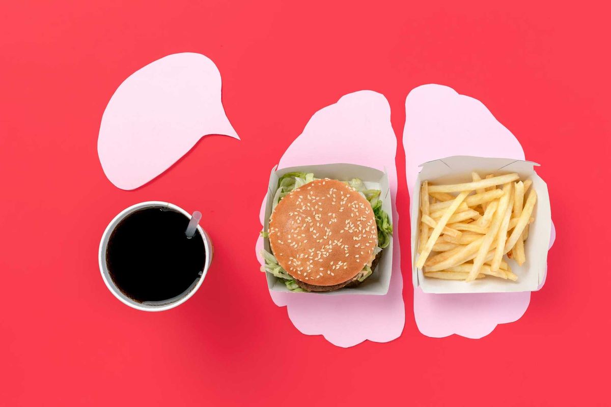 Burger and french fries in the form of brain isolated on red background. Unhealthy nutrition concept. Conceptual composition with copyspace