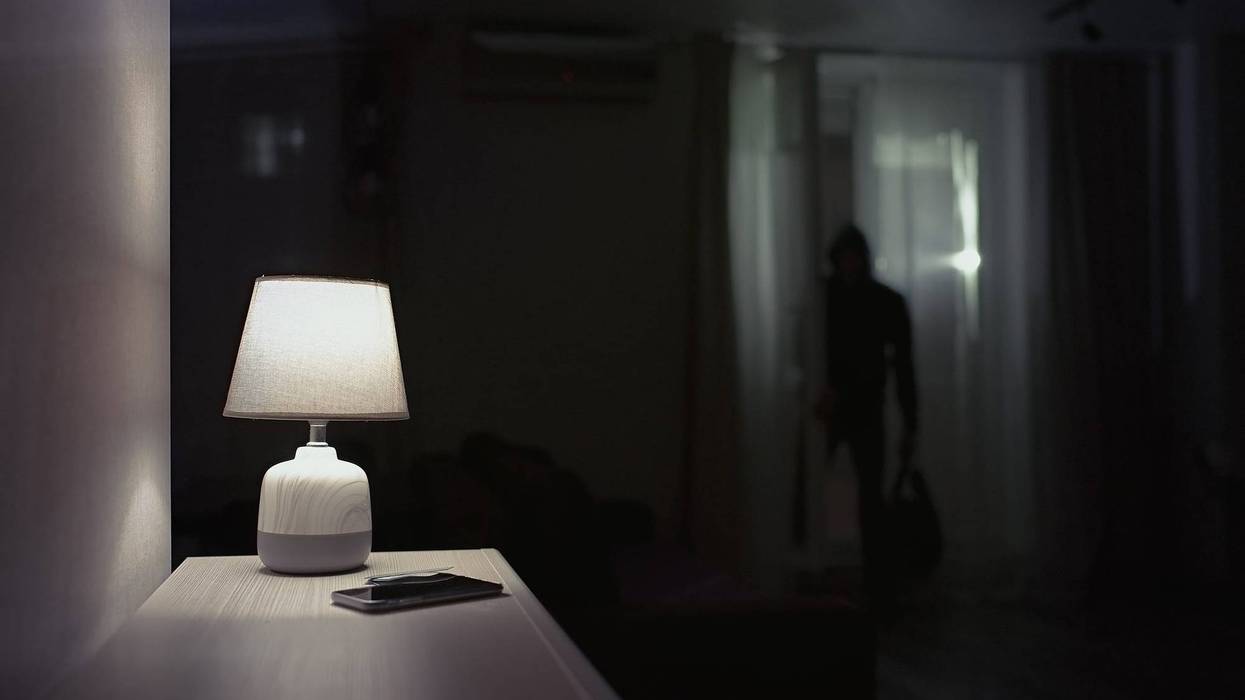 Burglar inside of a home.