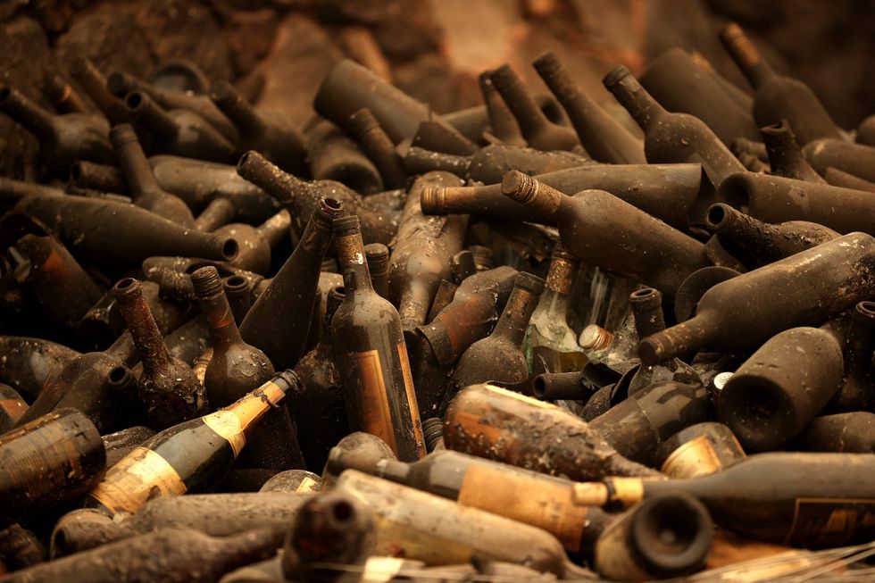 Burned bottles of wine sit in a pile at Castello di Amorosa that was destroyed by the Glass Fire on October 01, 2020 in Calistoga, California.