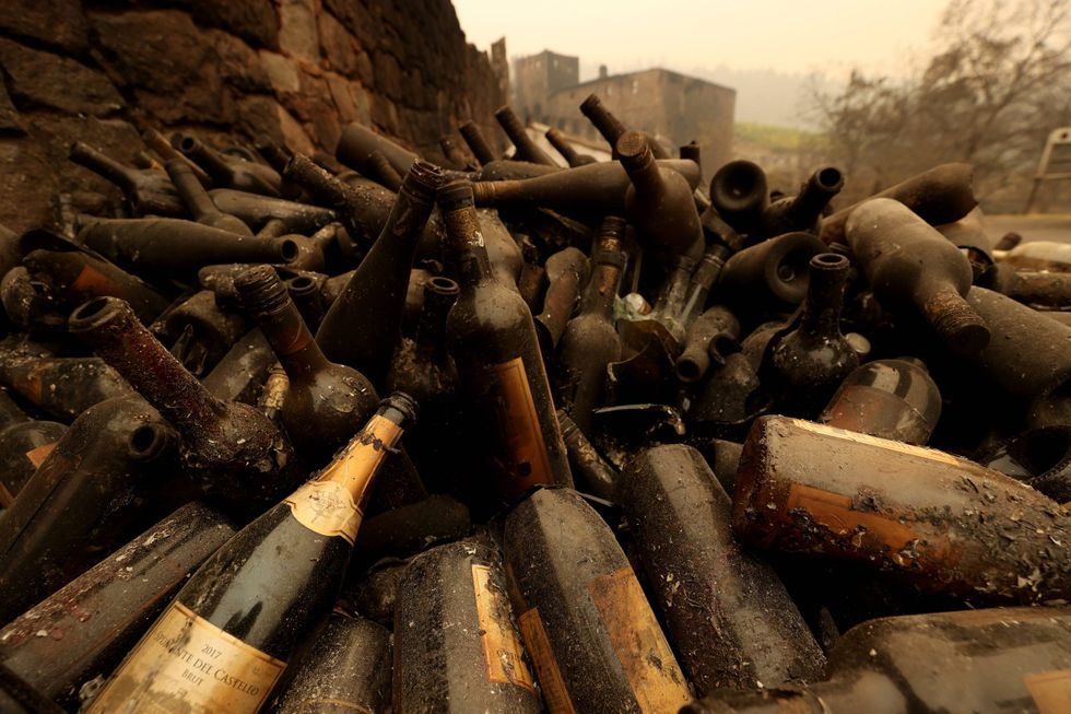 Burned bottles of wine sit in a pile at Castello di Amorosa that was destroyed by the Glass Fire on October 01, 2020 in Calistoga, California.