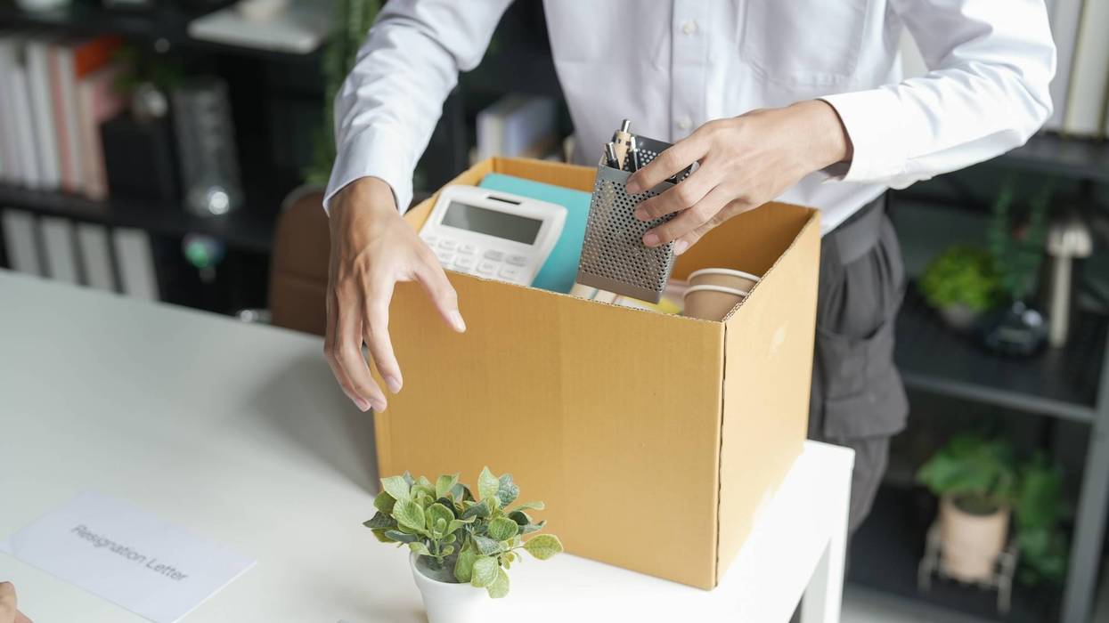 Business man sending resignation letter and packing Stuff Resign Depress or carrying business cardboard box Change of job or fired from company resign.