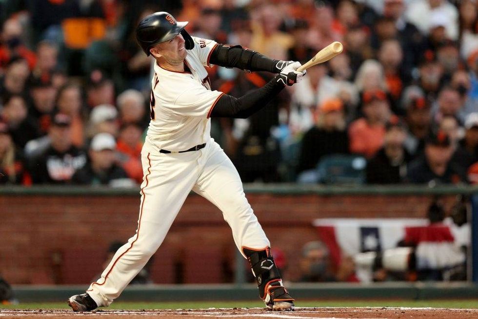 Buster Posey #28 of the San Francisco Giants strikes out in the first inning against the Los Angeles Dodgers during Game 2.