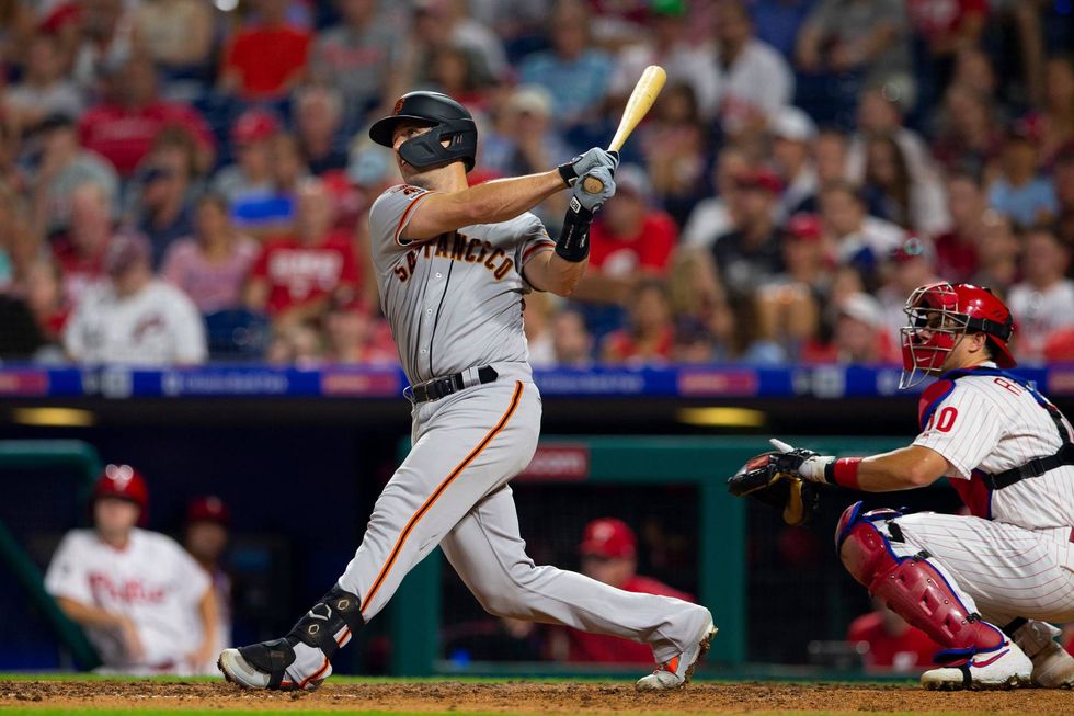 Buster Posey takes a cut in a game against the Philadelphia Phillies