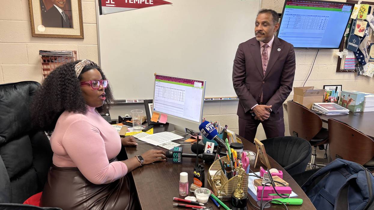 C.C.A. Baldi Middle School Principal Bianca Gillis demonstrates the new digital hall pass system to School District Superintendent Tony Watlington.