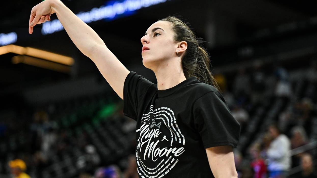 Caitlin Clark #22 of the Indiana Fever wears a shirt honoring Maya Moore as she warms up before the game against the Minnesota Lynx at Target Center on Aug. 24, 2024, in Minneapolis, Minnesota.