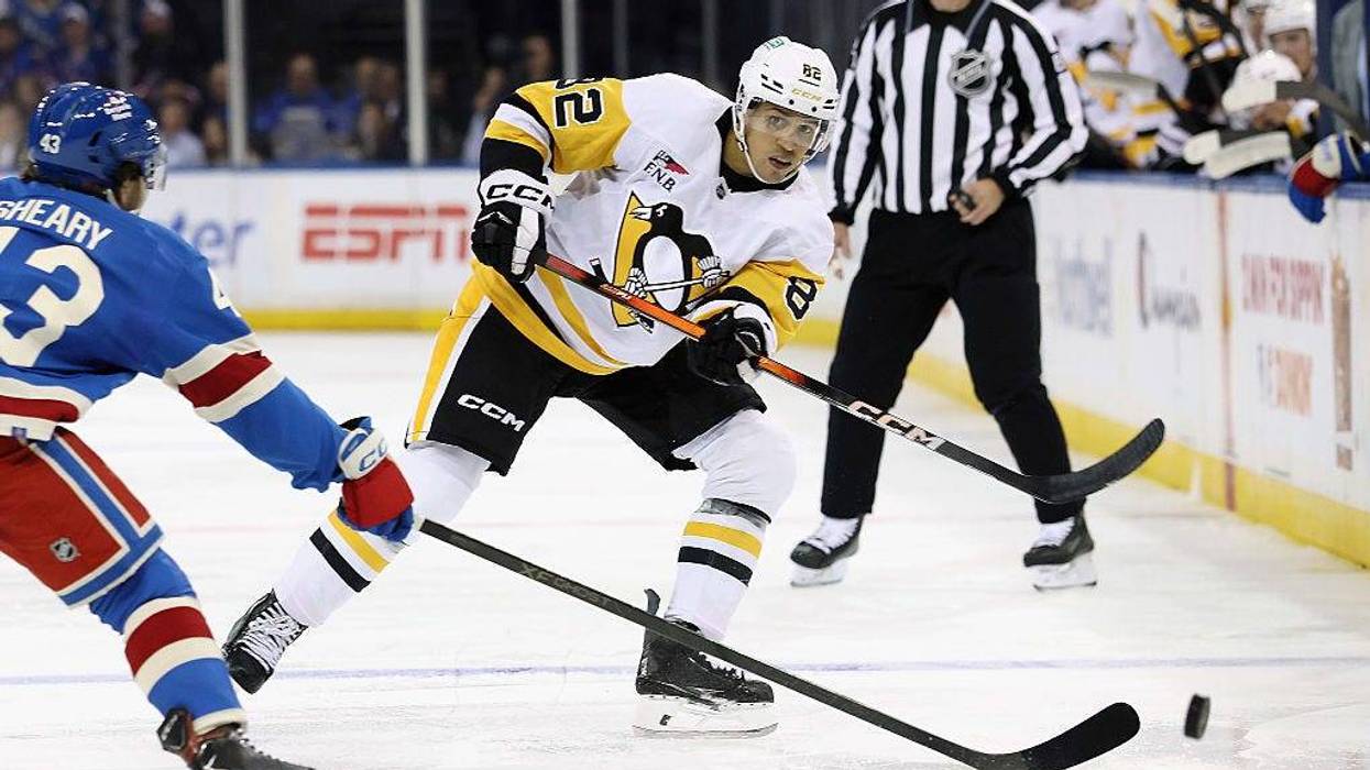 Caleb Jones playing for Pens