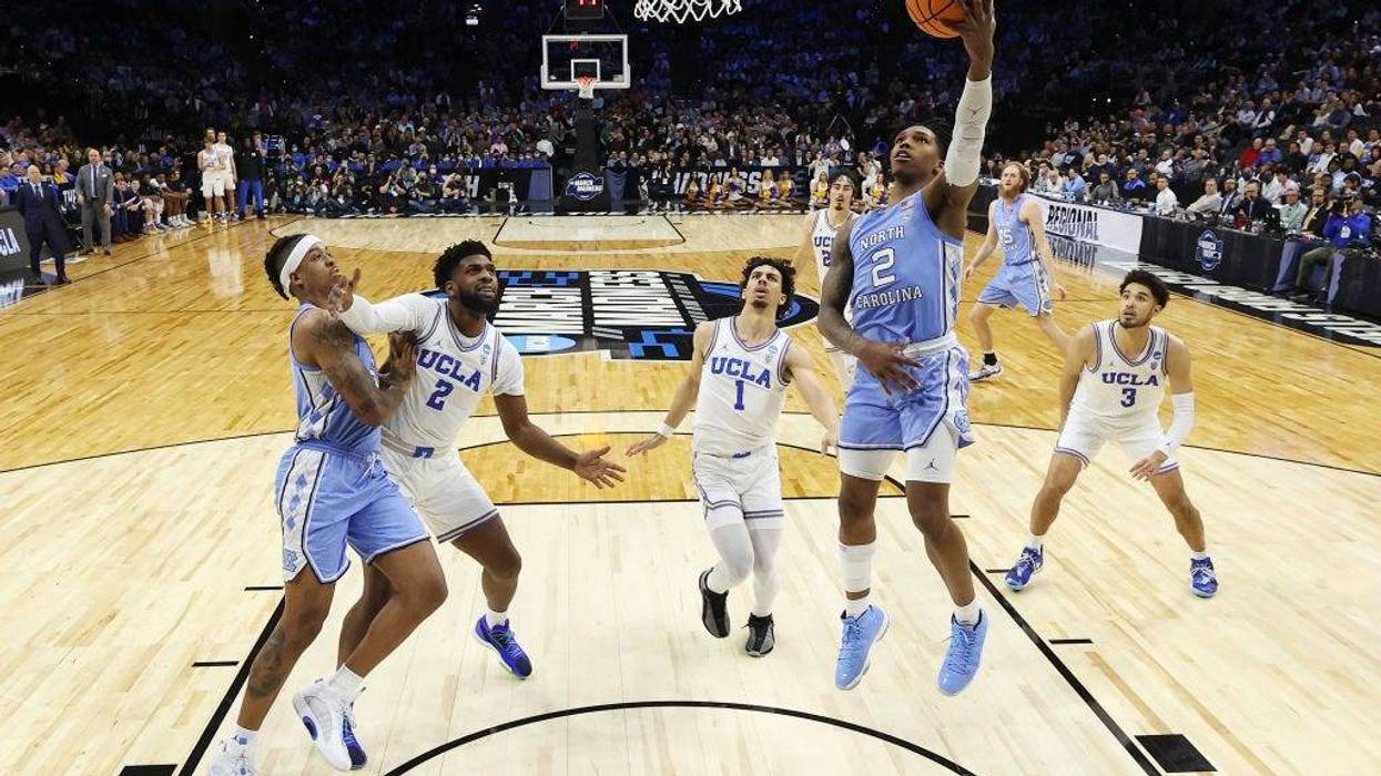 Caleb Love #2 of the North Carolina Tar Heels jumps to dunk the ball in the game against the UCLA Bruins in the Sweet Sixteen round game of the 2022 NCAA Men's Basketball Tournament at Wells Fargo Center on March 25, 2022 in Philadelphia, Pennsylvania.