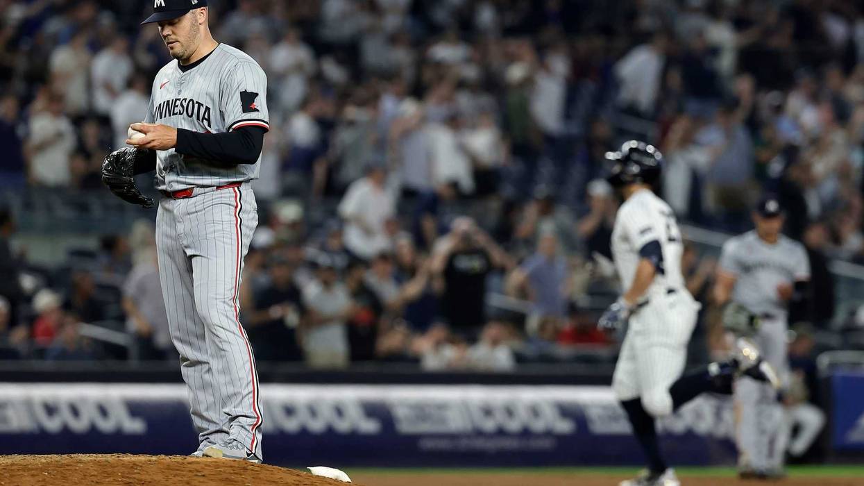 Caleb Thielbar #56 of the Minnesota Twins reacts after giving up a 2-run home run to Giancarlo Stanton #27 of the New York Yankees during the eighth inning at Yankee Stadium on June 4, 2024 in New York City. The Yankees won 5-1.