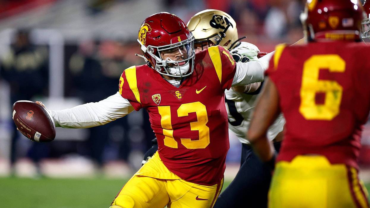 Caleb Williams #13 of the USC Trojans runs the ball against the Colorado Buffaloes in the second half at United Airlines Field at the Los Angeles Memorial Coliseum on November 11, 2022 in Los Angeles, California.