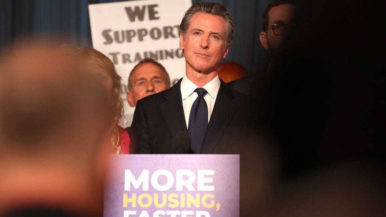 California Gov. Gavin Newsom (C) looks on during a press conference on September 28, 2022 in San Francisco, California.
