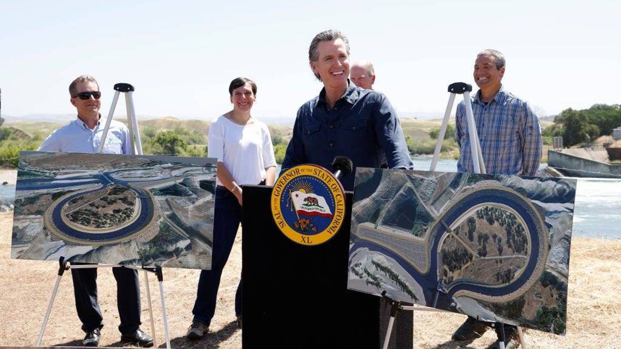 California Gov. Gavin Newsom (C) speaks to the media while displaying fishway renderings, as Willie Whittlesey, Yuba Water Agency General Manager (L-R), Cathy Marcinkevage, NMFS Assistant Regional Administrator, Chuck Bonham, CDFW Director, and Wade Crowfoot, CNRA Secretary listen in during a press conference at the Lower Yuba River and the Daguerre Point Dam on May 16, 2023 in Marysville, California.