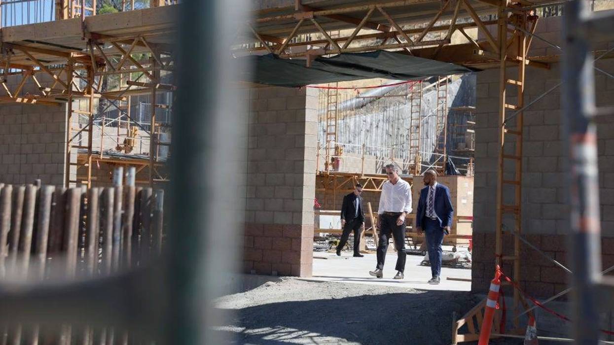 California Gov. Gavin Newsom (L) walks with Antioch Mayor Lamar Thorpe (R) as they tour a desalination plant that is under construction at the Antioch Water Treatment Plant on August 11, 2022 in Antioch, California.