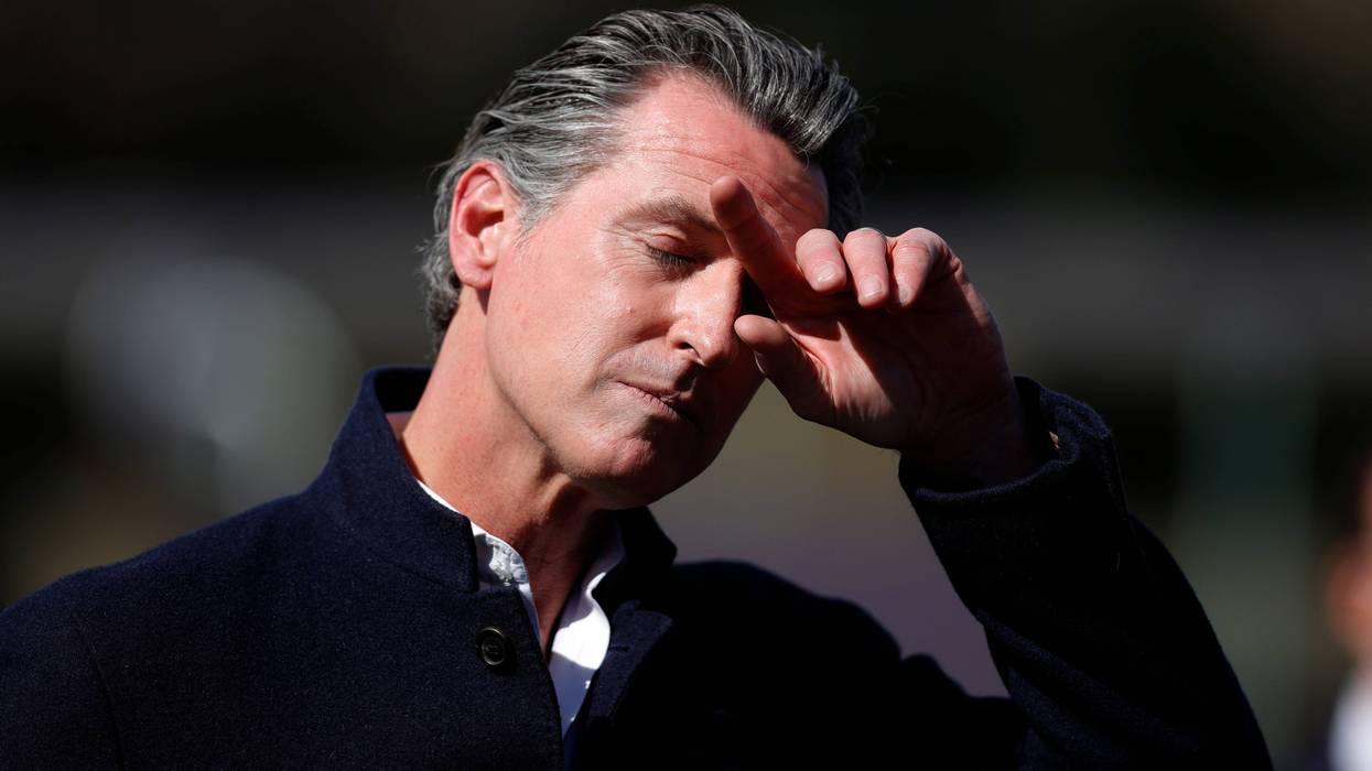California Gov. Gavin Newsom pauses during a news conference after touring Barron Park Elementary School