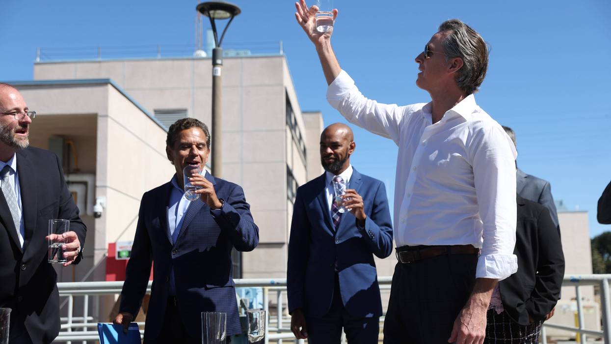 California Gov. Gavin Newsom (R) prepares to taste wastewater that was treated at the Antioch Water Treatment Plant with former Los Angeles Mayor Antonio Villaraigosa (L) and Antioch Mayor Lamar Thorpe (C) on August 11, 2022 in Antioch, California.