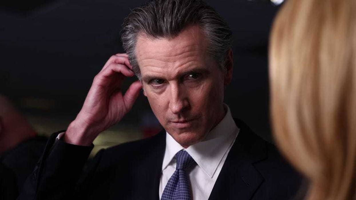 California Gov. Gavin Newsom talks to reporters in the spin room following the FOX Business Republican Primary Debate at the Ronald Reagan Presidential Library on September 27, 2023 in Simi Valley, California.