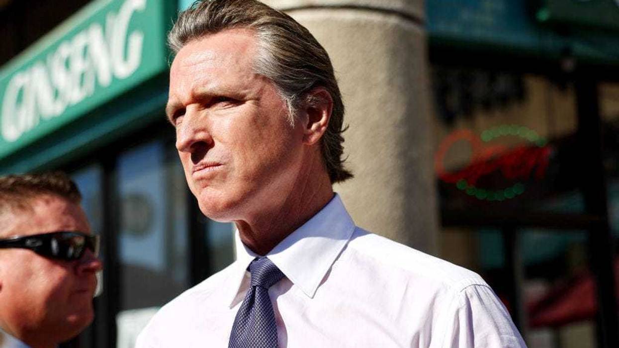 California Governor Gavin Newsom stands near the scene of a deadly mass shooting at a ballroom dance studio on January 23, 2023 in Monterey Park, California.