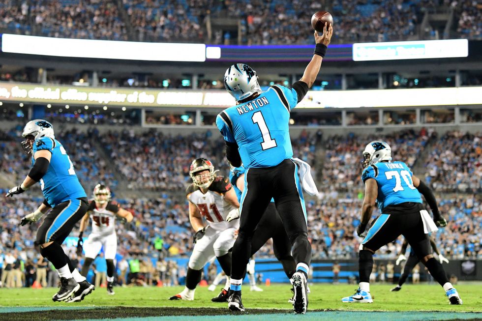 Cam Newton gets off a pass against Tampa Bay