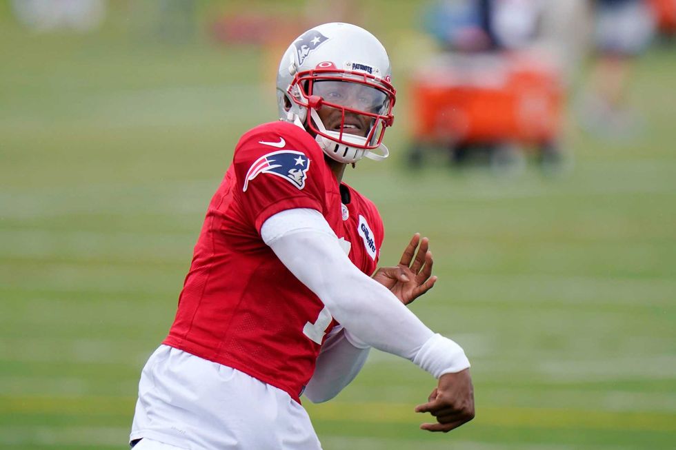 Cam Newton getting his arm loose at Patriots training camp