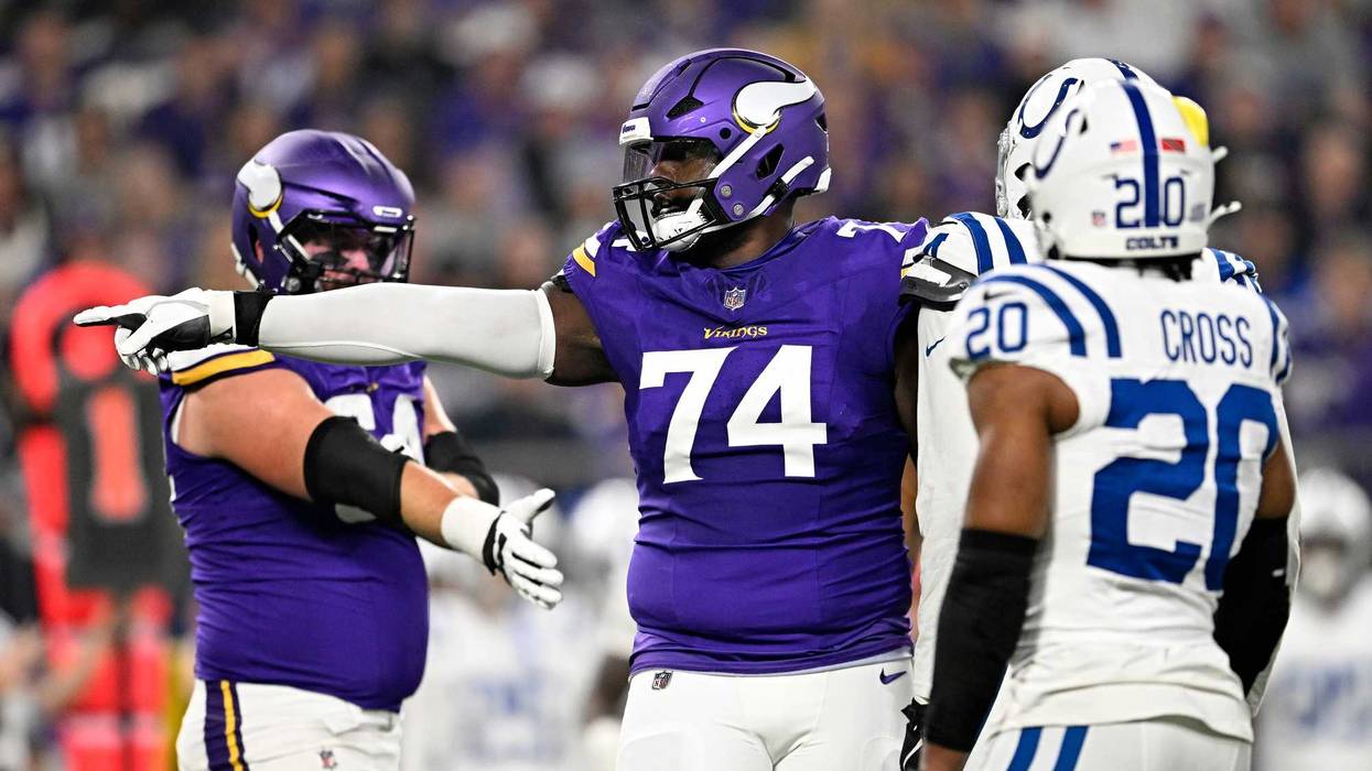 Cam Robinson #74 of the Minnesota Vikings reacts during the first quarter against the Indianapolis Colts at U.S. Bank Stadium on November 03, 2024 in Minneapolis, Minnesota.