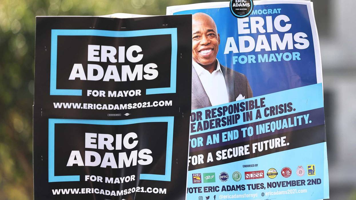 Campaign signs for Eric Adams are seen in front of Brooklyn Borough Hall on Oct. 22, 2021.