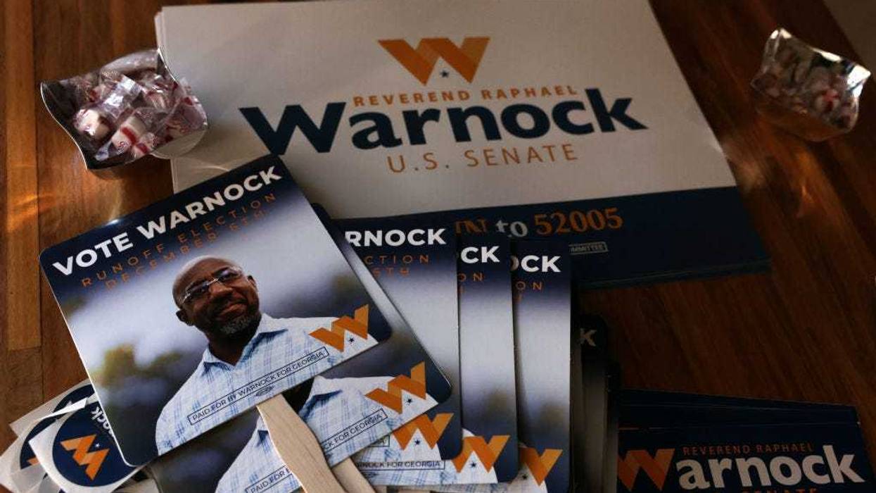 Campaign signs for Georgia Democratic Senate candidate U.S. Sen. Raphael Warnock (D-GA) are seen during a campaign rally on December 2, 2022 in Savannah, Georgia. Sen. Warnock continues to campaign in Georgia for the December 6 runoff election against Republican challenger Herschel Walker. The early voting period finishes at the end of the day. (Photo by Alex Wong/Getty Images)