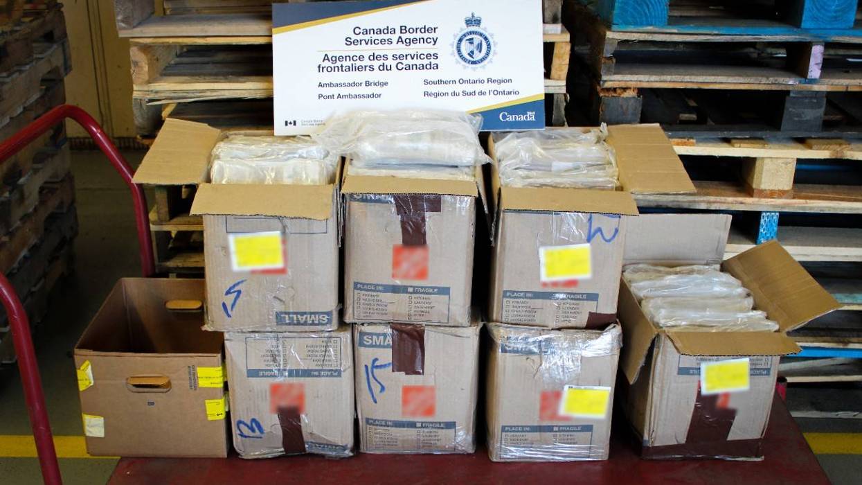 Canada Border Services Agency display of seized drugs in cardboard boxes.