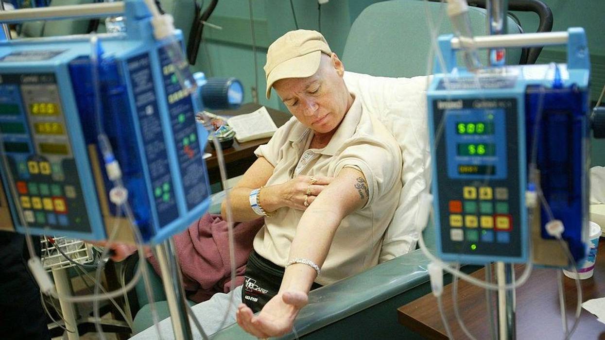 Cancer patient Ellen Walsh checks her muscle tone during chemotherapy treatment at Cape Fear Valley Medical Center June 17, 2003 in Fayetteville, North Carolina.